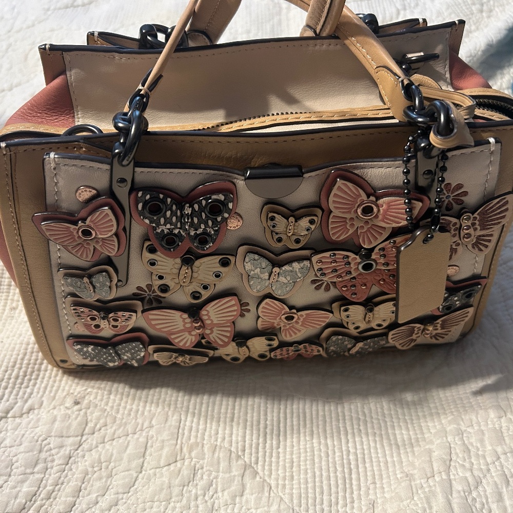 Coach dreamer with butterfly applique and snake skin detail
